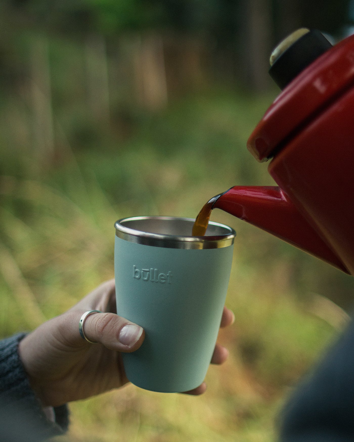 campfire coffee being poured into a bullet cup