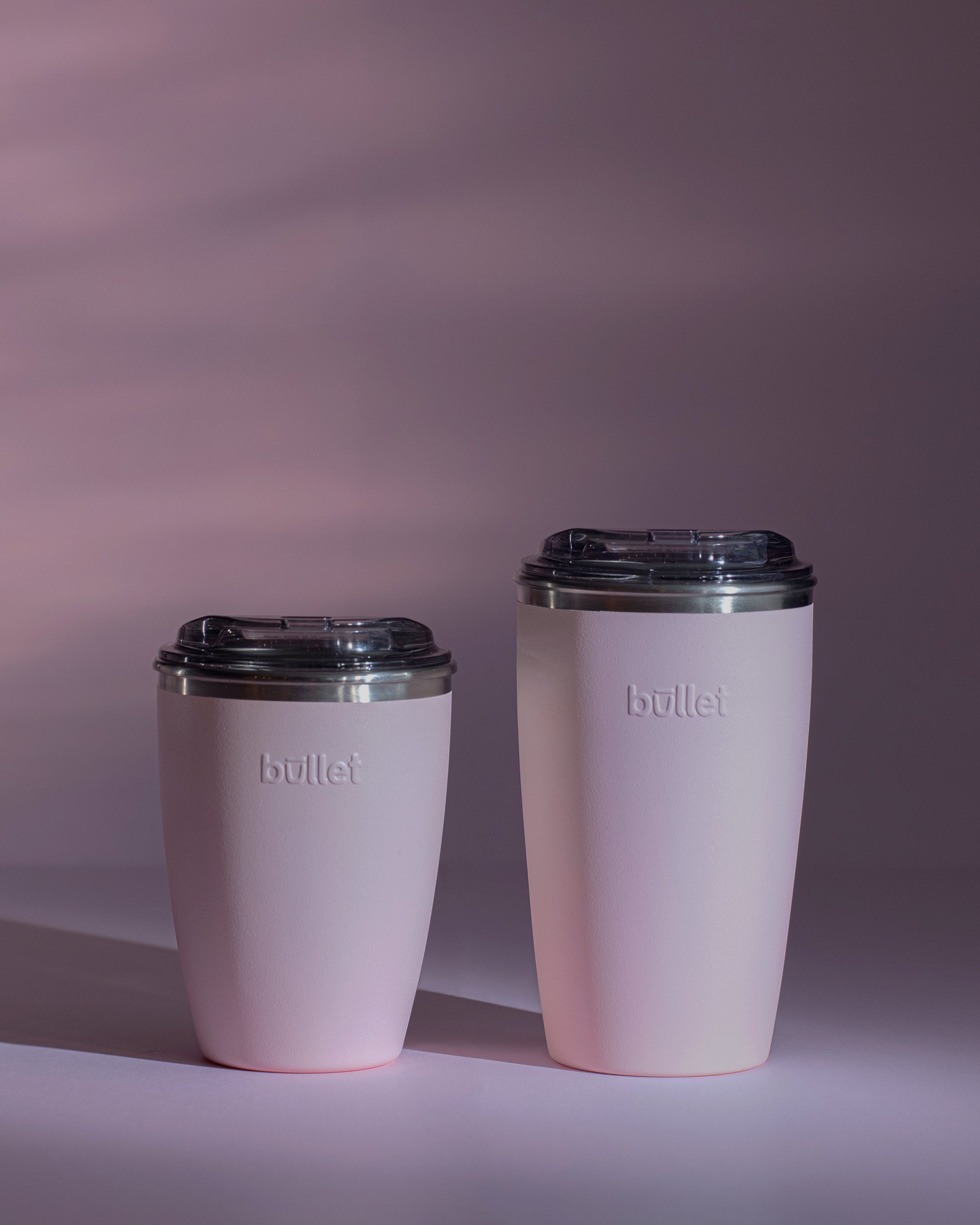 Side by side comparison of an 8oz and 12oz pink Bullet cup